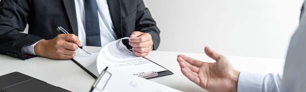 midsection-man-using-mobile-phone-table
